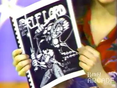 Image shows the hands of a kid holding a 1970s copy of Elflord